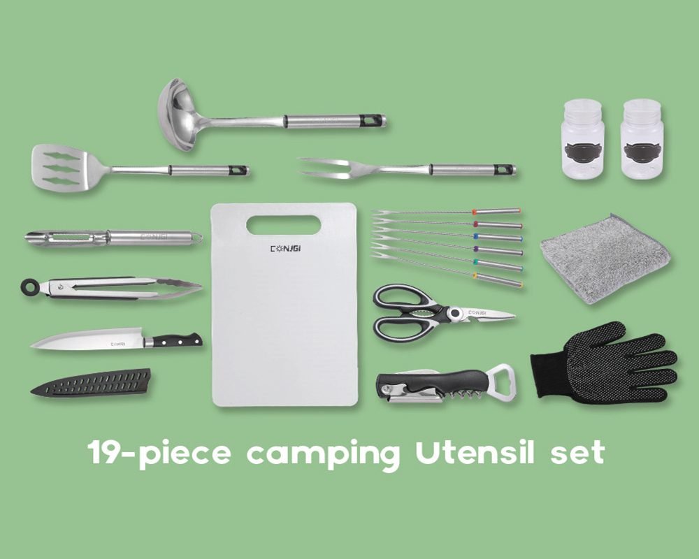 19-piece Conigi camping utensil set laid out, including a ladle, spatula, carving fork, peeler, tongs, chef knife with sheath, cutting board, two spice shakers, five skewers, cleaning cloth, kitchen scissors, bottle opener/corkscrew, and a protective glove.