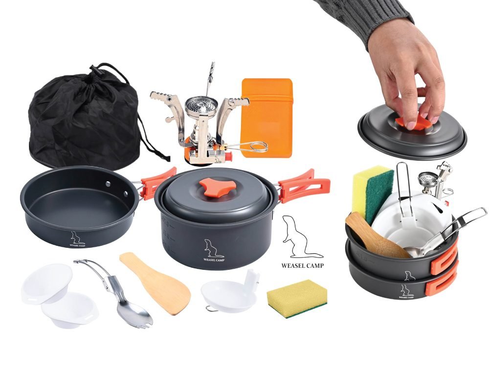 A comprehensive "WEASEL CAMP" lightweight portable camping cookware set laid out, showing a frying pan, cooking pot with lid, mini stove, orange storage box, drawstring carry bag, two white bowls, a folding spork, wooden spatula, ladle, sponge, and an assembled view of the nested set with a hand placing the lid.