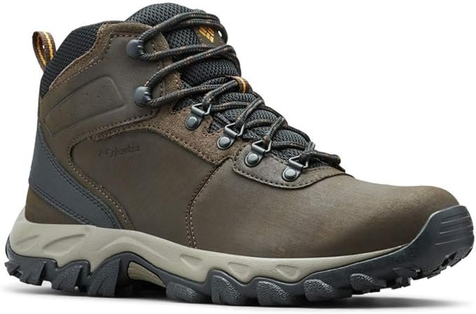 A brown Columbia Newton Ridge Plus II hiking boot, a durable mid-ankle waterproof leather boot designed for men and women, with a lighter tan midsole and textured black outsole.