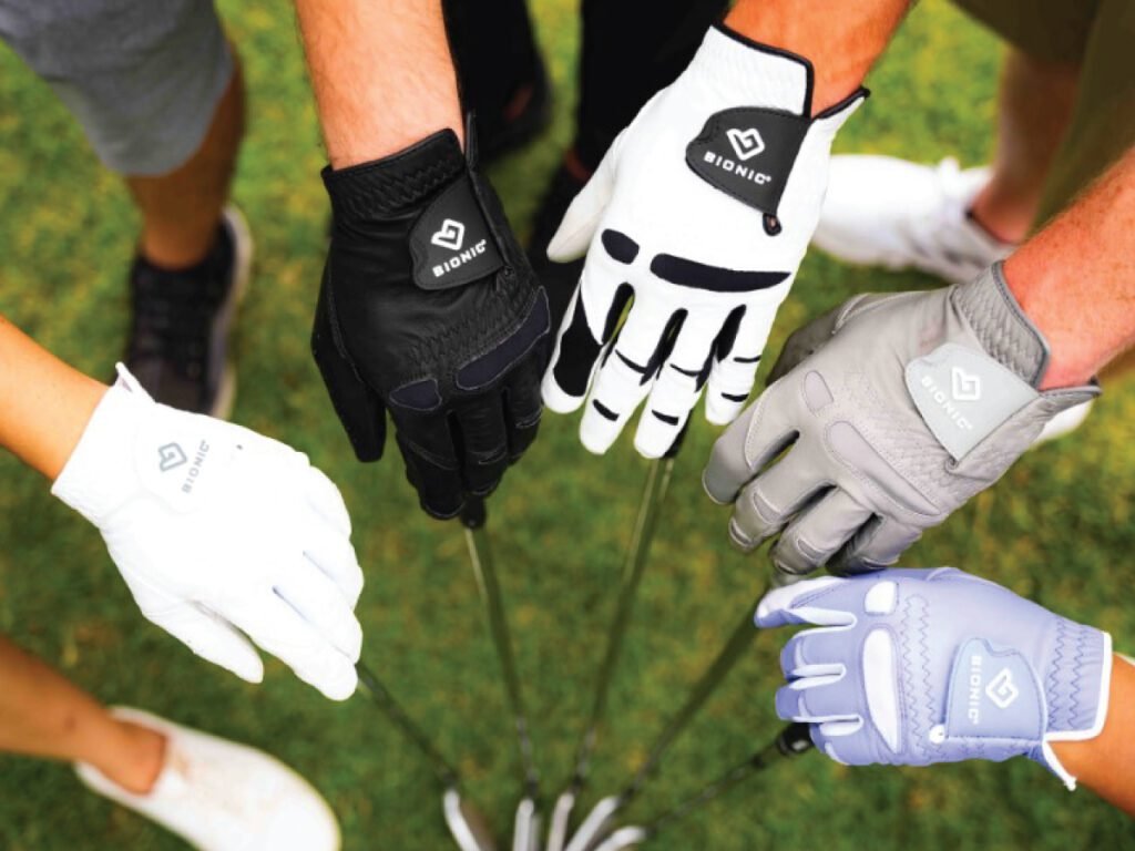 A group of golfers wearing a variety of different Bionic brand golf gloves in white, black, gray, and light blue, with golf clubs visible in the center. A great choice for a winter golf glove.